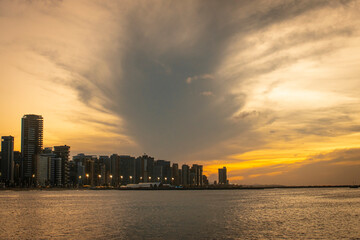 A beautiful view of a sunset, on the beach of Fortaleza-CE, Brazil, with a twilight. Exclusive and authorial photography.