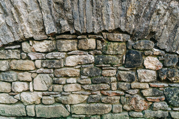 Stone wall background for graphic and leaflet use. Ancient masonry brickwork .