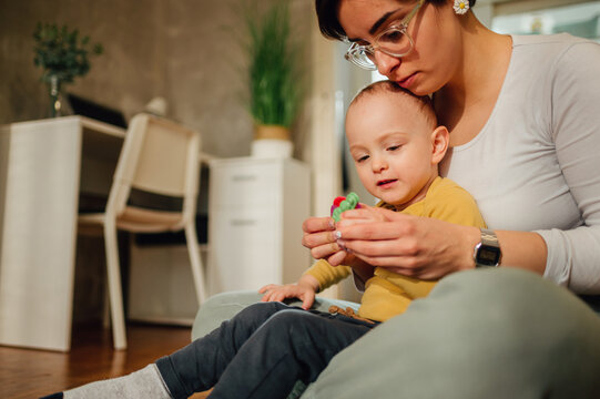 Mother and son molding a clay at home and having educational act