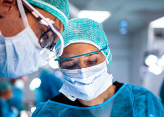 Surgeons practicing maxillofacial surgery in a simulation lab