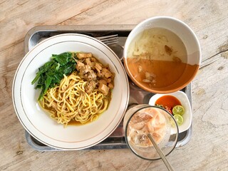 Noodle chicken soup (mie ayam) Indonesia food served on bowl.