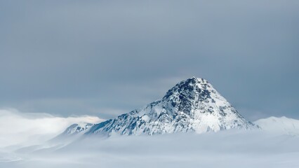 mountain top above the clouds