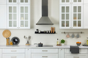 Elegant kitchen interior with range hood and furniture