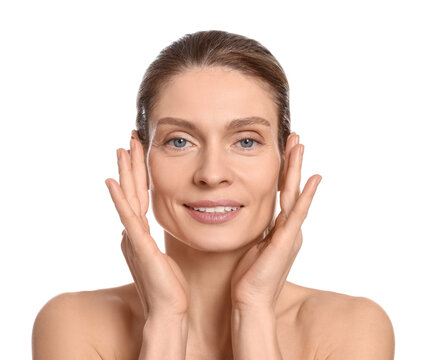 Woman massaging her face on white background