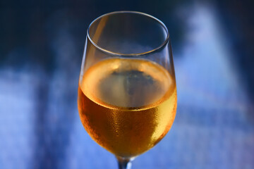 a glass of white wine in a restaurant, alcohol luxury background