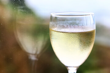 a glass of white wine in a restaurant, alcohol luxury background
