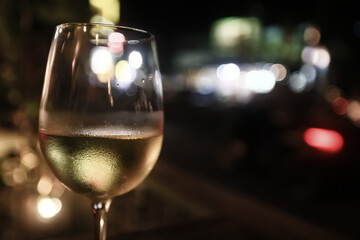 white wine tasting, chilled ice wine in a cold glass in summer