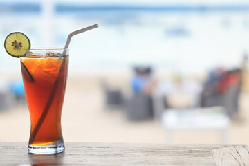 iced tea with ice and lemon at the beach bar