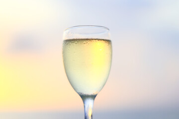 a glass of white wine in a restaurant, alcohol luxury background