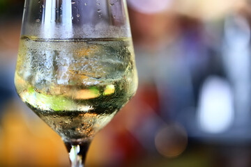 white wine tasting, chilled ice wine in a cold glass in summer