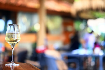 white wine tasting, chilled ice wine in a cold glass in summer