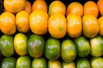 Tangerine mandarin Assorted fresh fruits and vegetables in peruvian market