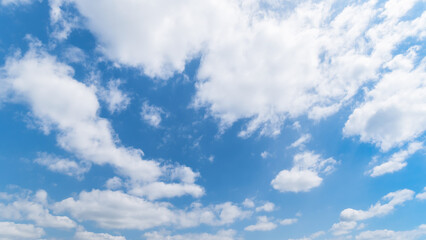 Panoramic view of clear blue sky and clouds, Blue sky background with tiny clouds. White fluffy clouds in the blue sky.
