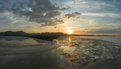 Aerial view sunset shot made with drone on the island of Koh Yao Yai, Phuket. .4K Shooting With Drone. Beach in tropical paradise, Koh Yao Yai island in Phang-nga, Thailand. .Landscape with tropical.