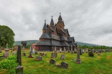 Fototapeta na wymiar Stave Church in Heddal - a stave church located in the Norwegian town of Heddal, in the municipality of Notodden, in the Telemark region. It is the largest of 28 churches of this type in Norway