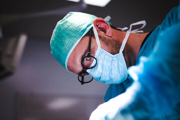 Surgical trainee focused on neurosurgery during a simulation training operation