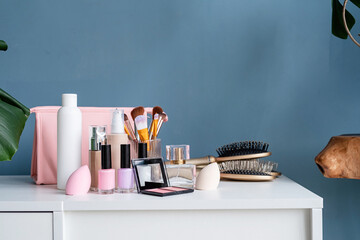 closeup of feminine cosmetic products standing on dressing table