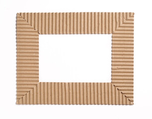 Photo frame made with waste cardboard paper. A craft project with recycled material.