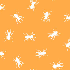Seamless pattern with simple silhouettes of stag beetles,