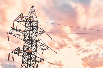 high-voltage power transmission tower in Ukraine on sky background. Electrical line insulators....