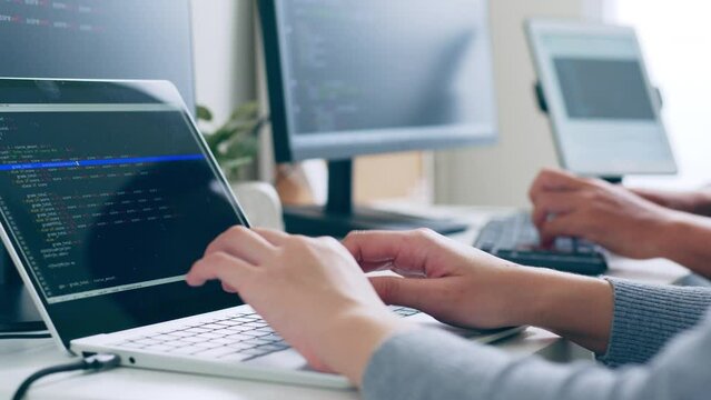 Closeup hand of developer programmer, software engineer, IT support, typing on computer keyboard