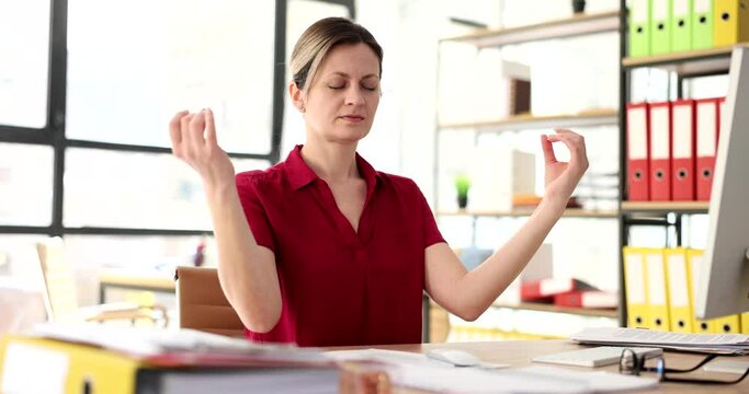 Tired businesswoman with closed eyes meditating in office 4k movie slow motion