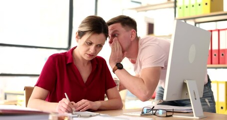 Man colleague telling businesswoman interesting news in office 4k movie slow motion