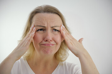 Portrait of attractive overwhelmed desperate girl bad news reaction fail isolated over white color background. High quality photo