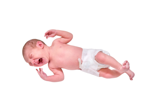 Portrait of a baby boy aged 1 month lying with his eyes open, isolated on a white background. Caucasian child in the children bedroom on the bed
