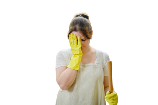 A crying woman holds her head with her hand while cleaning in a home kitchen, isolated on a white background