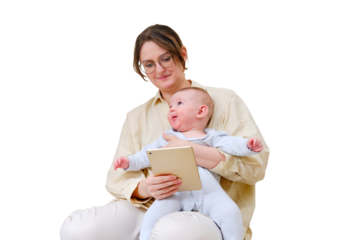 Happy woman mother with infant baby watching in digital tablet while sitting on home sofa in living room, isolated on a white background. Kid aged six months