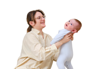 Happy woman mother playing with infant baby on home sofa in living room, isolated on a white background. Kid aged six months
