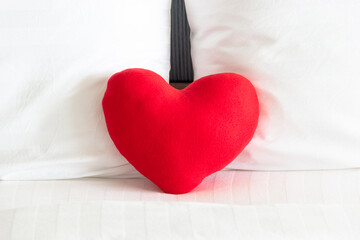Close up of Red heart and Couple white pillow on the bed for love, wedding and valentine's day concept