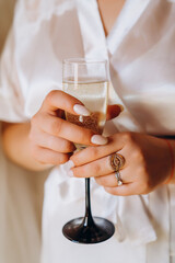 Wedding glasses with champagne in couple's hands