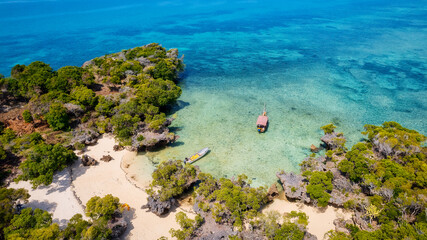 Experience Zanzibar's Blue Safari on a traditional wooden dhow boat. Dive into coral reefs, explore deserted islands in the middle of the ocean