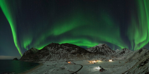 Northern Lights - Aurora Borealis fill sky over Haukland beach, VestvÃ¥gÃ¸y, Lofoten Islands, Norway