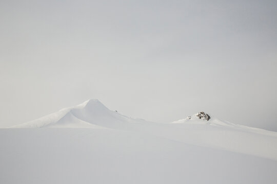 A landscape image of the snow covered peaks in the Whistler backcountry as seen during the Spearhead Traverse in the Coast Mountains of British Columbia, Canada.