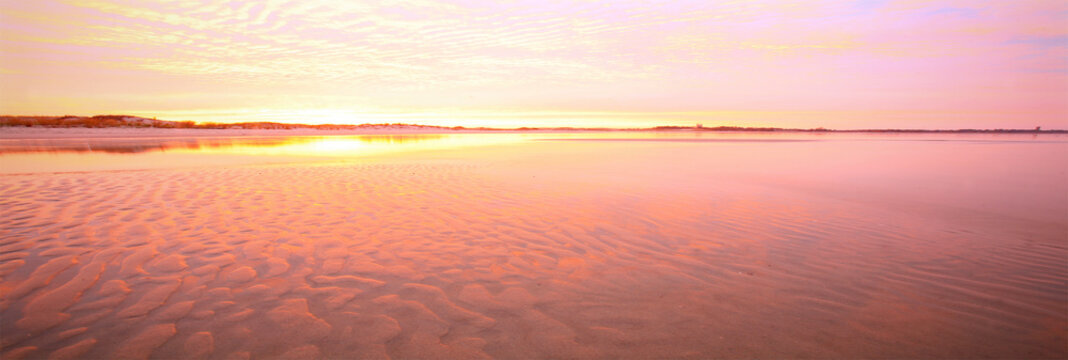 A stretch along the sandy beach of Cape Henlopen State Park, Delaware taken at sunrise.