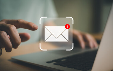 Businessman working in front of laptop computer while check email or online text message from...