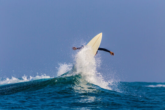Surfing a wave,Bali,Indonesia.