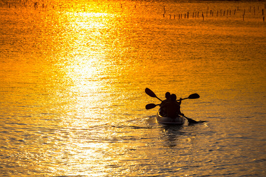 Kayaking at sunset time.