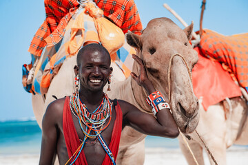 Maasai warrior with a camel, entertainment for tourists beach in Kenya