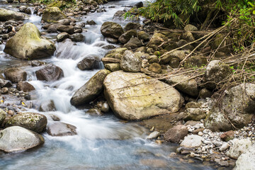 A Peaceful Escape: Slow Shutter Speed Photography of Water Flowing Among the Rocks