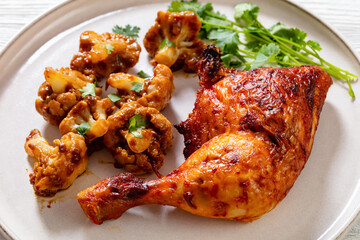 baked chicken leg with spicy roast cauliflower