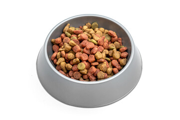 Plastic animal bowl with dry feed. Isolated on white.