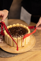 hands of a person with cake