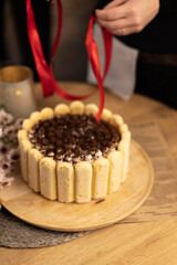 hands of a person with cake