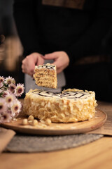 hands of a person with a cake