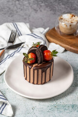 Cake. Chocolate and strawberry cake in a plate. close up