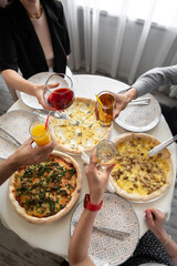 person holding a bowl of pizza